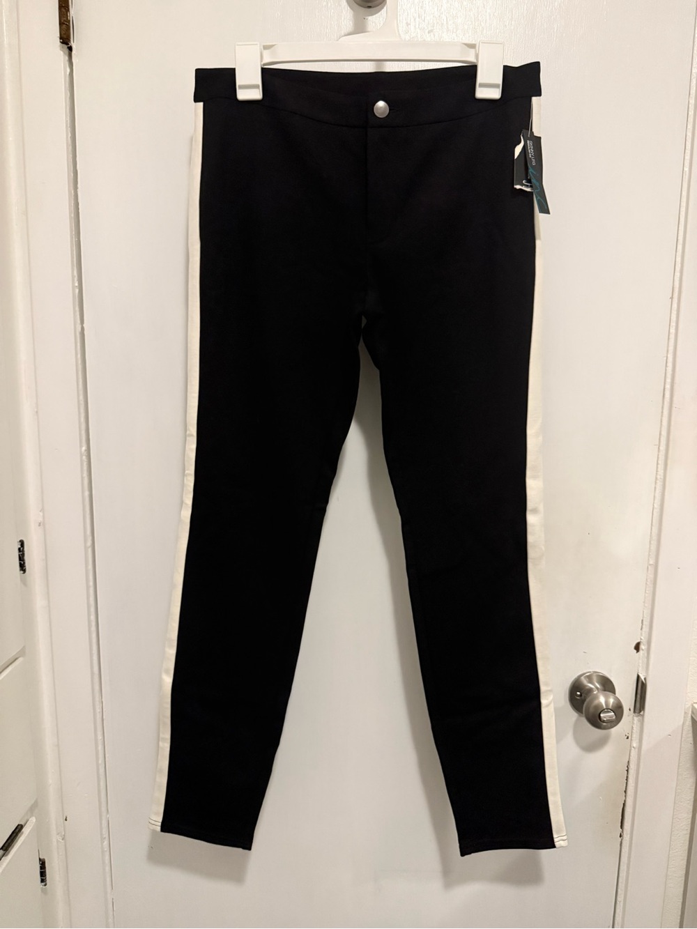 New International Concepts black skinny pants w/ white stripe; size 8 inseam 29”